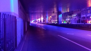 Neon light bellow an elevated highway